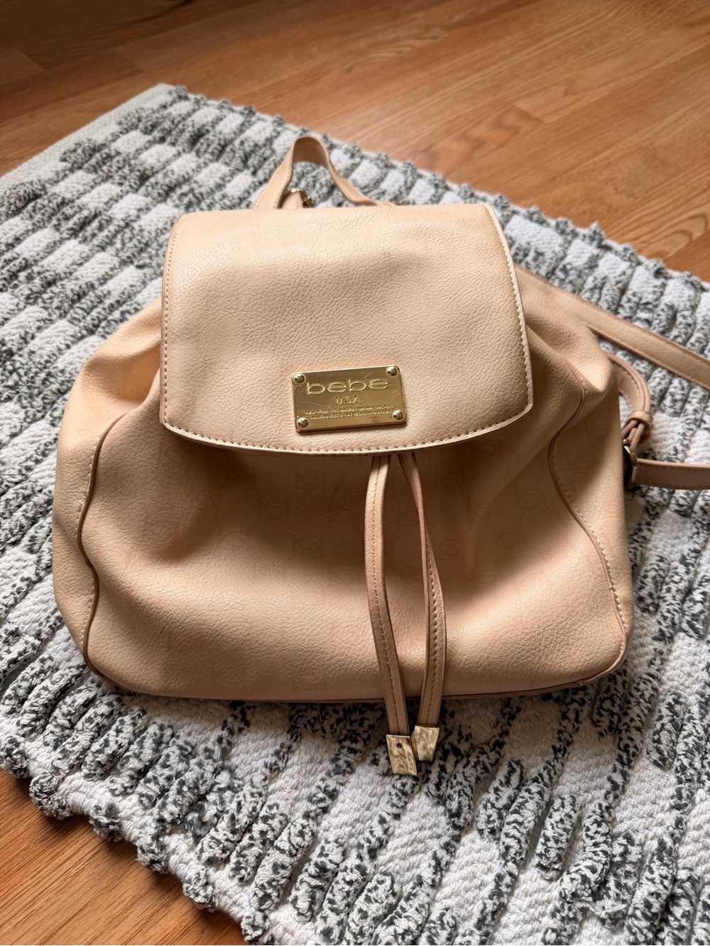 bebe Nude Beige Drawstring Backpack with Gold Plate